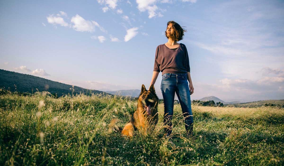 dog-with-girl-on-fields